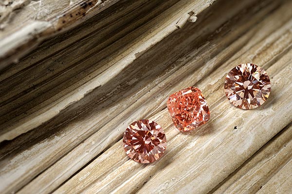 3 geslepen diamanten fancy colored pink-orange
